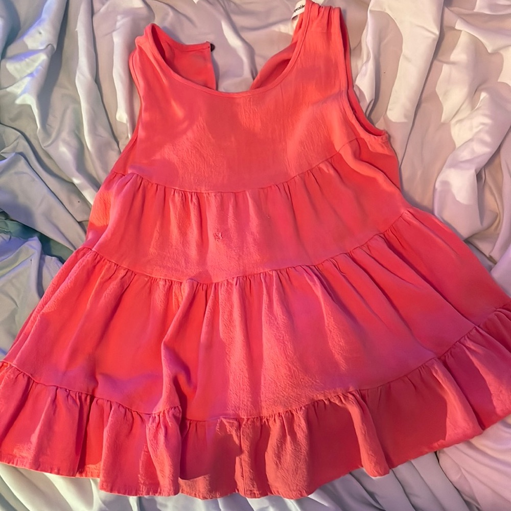 This is a pink impeccable pig float/beachy shirt